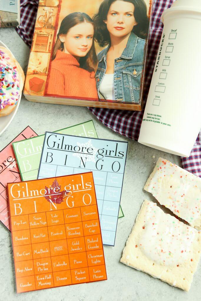 These Gilmore Girls bingo cards would be perfect for a party to watch the new show on Netflix on Black Friday! Who will we see first - will it be Rory, Lorelai, and Luke or maybe some junk food like pop-tarts. Doesn’t matter if you’re Team Logan, Jess, or Dean, you’ll love these ideas for funny games during a Gilmore Girls viewing party! I’m definitely printing them out to play with my sister!