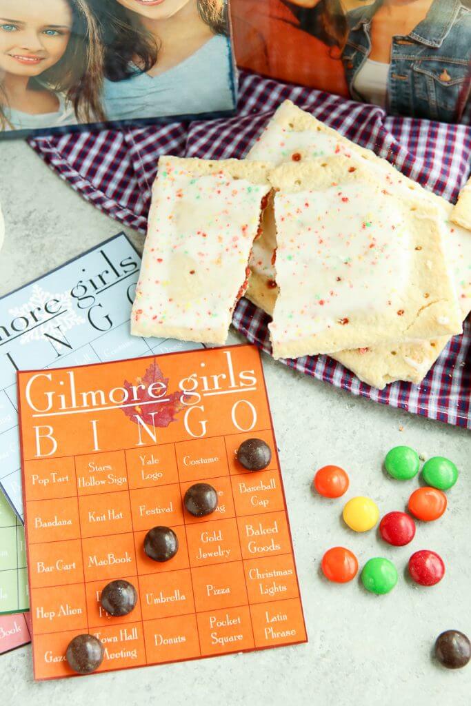 These Gilmore Girls bingo cards would be perfect for a party to watch the new show on Netflix on Black Friday! Who will we see first - will it be Rory, Lorelai, and Luke or maybe some junk food like pop-tarts. Doesn’t matter if you’re Team Logan, Jess, or Dean, you’ll love these ideas for funny games during a Gilmore Girls viewing party! I’m definitely printing them out to play with my sister! 