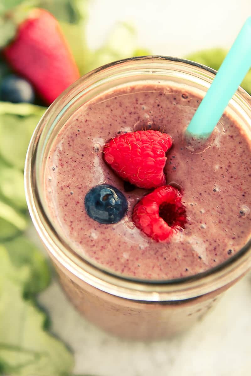 This triple berry smoothie recipe is one of the best fruit and yogurt smoothies out there. It’s a great healthy breakfast option, especially if you’re trying to lose weight or trying to up your protein for weight loss or a particular diet. Just combine frozen strawberry, green spinach, and a couple of other ingredients for one of the best smoothie recipes. I’m definitely making this easy smoothie for my kids this weekend!