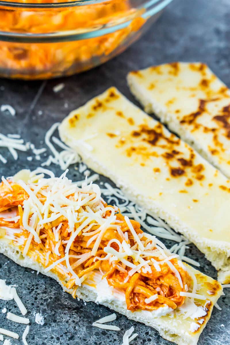 These buffalo chicken dip rollups combine buffalo chicken dip and a crisp naan exterior for the perfect game day food!