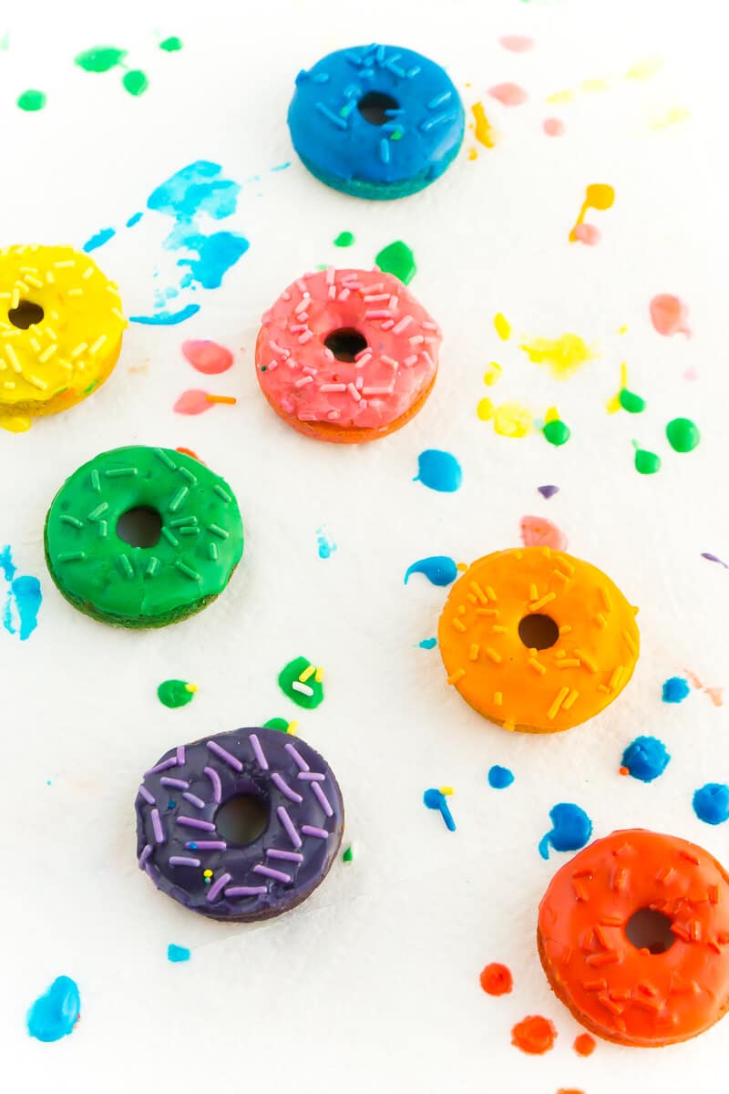 This rainbow donuts recipe is perfect for a rainbow party, St. Patrick's Day party food, or anytime you just need a little color in your life! Definitely one of the best rainbow foods and there's a secret ingredient that'll make you feel even better about eating them, way better than if you eat rainbow cake!