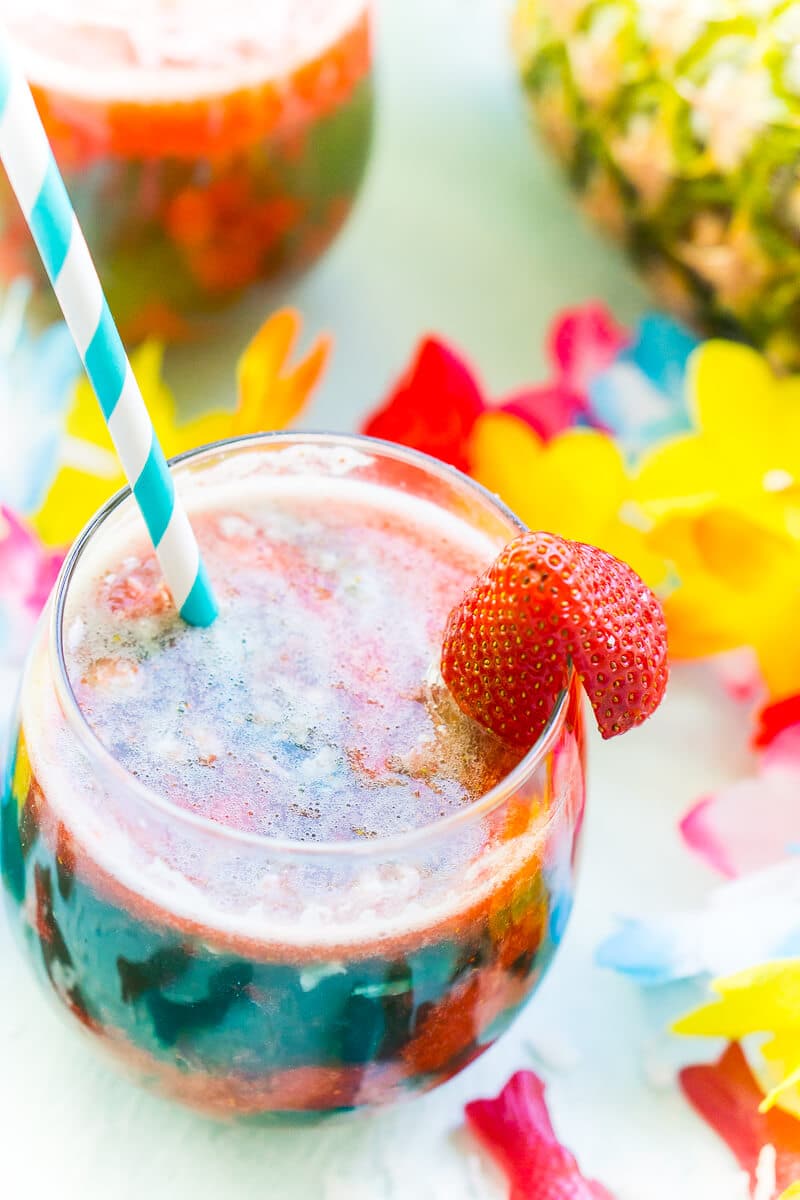 This easy mocktail recipe is inspired by Te Fiti in the movie Moana. With a little sweet strawberry puree mixed with tropical juices, it's the best mocktail for all ages!