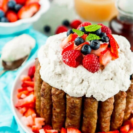 This sausage and pancakes breakfast cake with maple whipped cream needs to be on everybody’s list of Easter brunch recipes It’s impressive yet simple enough that anyone can make it, and it’s an Easter brunch food that everyone will be talking about for the next year! All of your favorite Easter breakfast foods combined in one delicious breakfast cake recipe! Kids and adults both will love it!