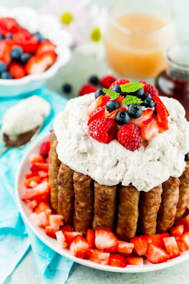 This sausage and pancakes breakfast cake with maple whipped cream needs to be on everybody’s list of Easter brunch recipes It’s impressive yet simple enough that anyone can make it, and it’s an Easter brunch food that everyone will be talking about for the next year! All of your favorite Easter breakfast foods combined in one delicious breakfast cake recipe! Kids and adults both will love it! 