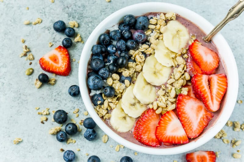 This red white and blue very berry smoothie bowl recipe is not only an easy and healthy breakfast option but also delicious! Add frozen strawberry, a little veggie protein powder, and your favorite berry for one great recipe! 