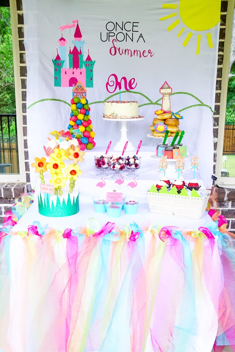 These once upon a summer first birthday ideas are perfect for a one-year-old girl! One of the cutest girl themes I’ve seen in a long time! Tons of DIY decorations, princess touches, creative party ideas, and even take home gifts for guests. Such a fun and modern theme!