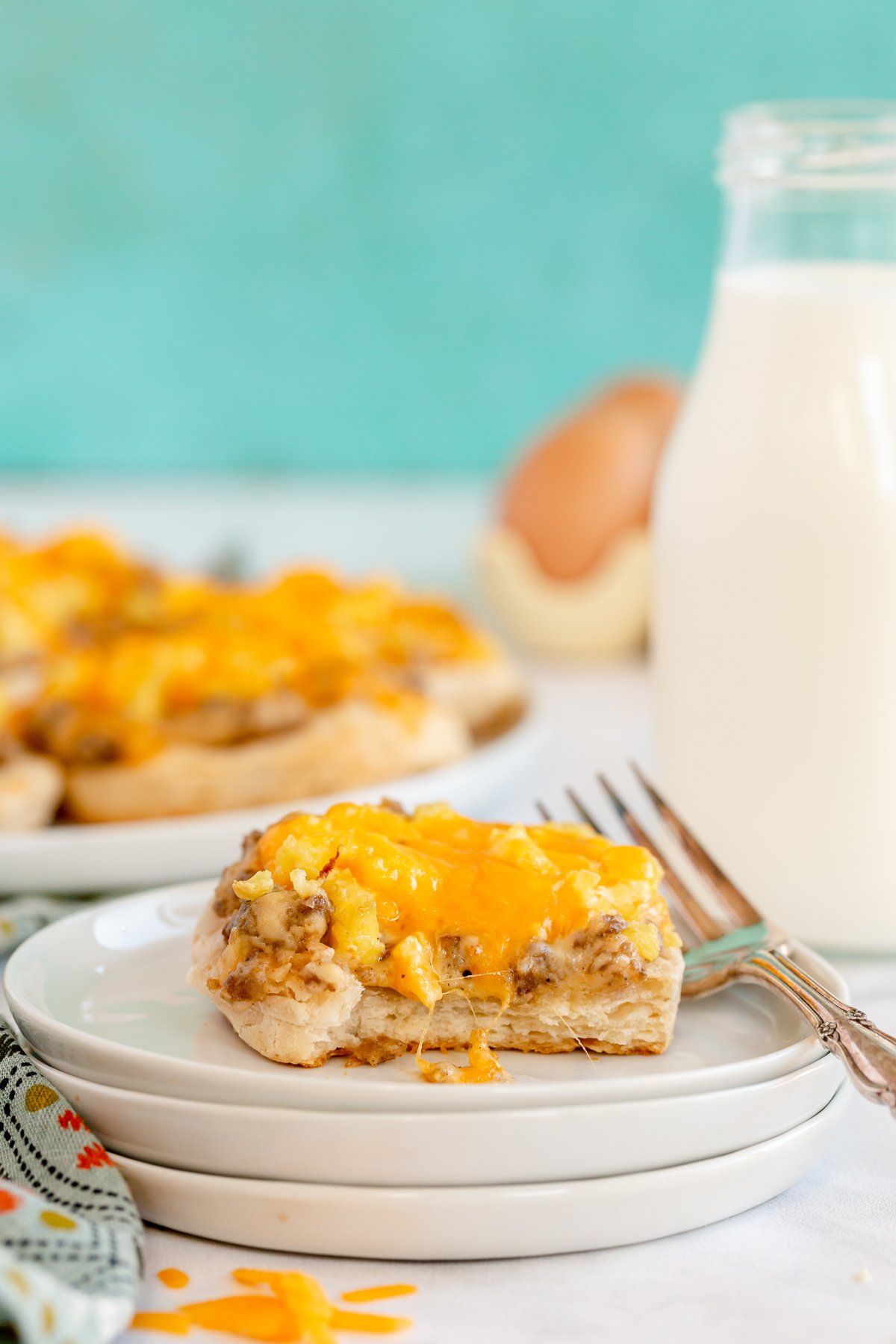 biscuits and gravy breakfast pizza on a white plate