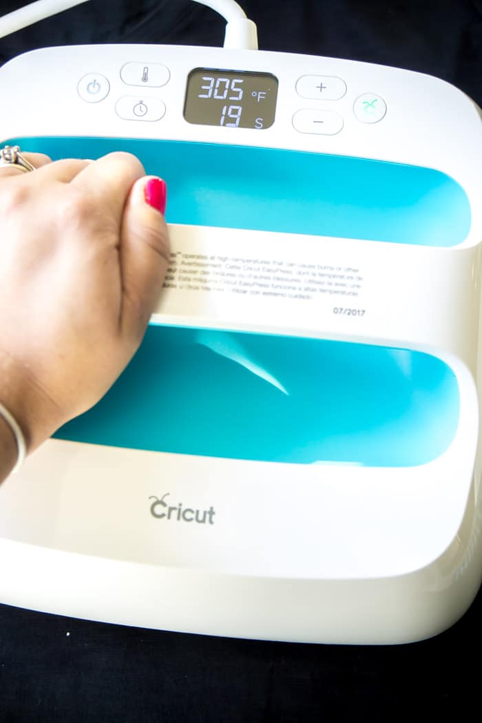 The Cricut Easy Press makes iron on vinyl stick better than with an iron