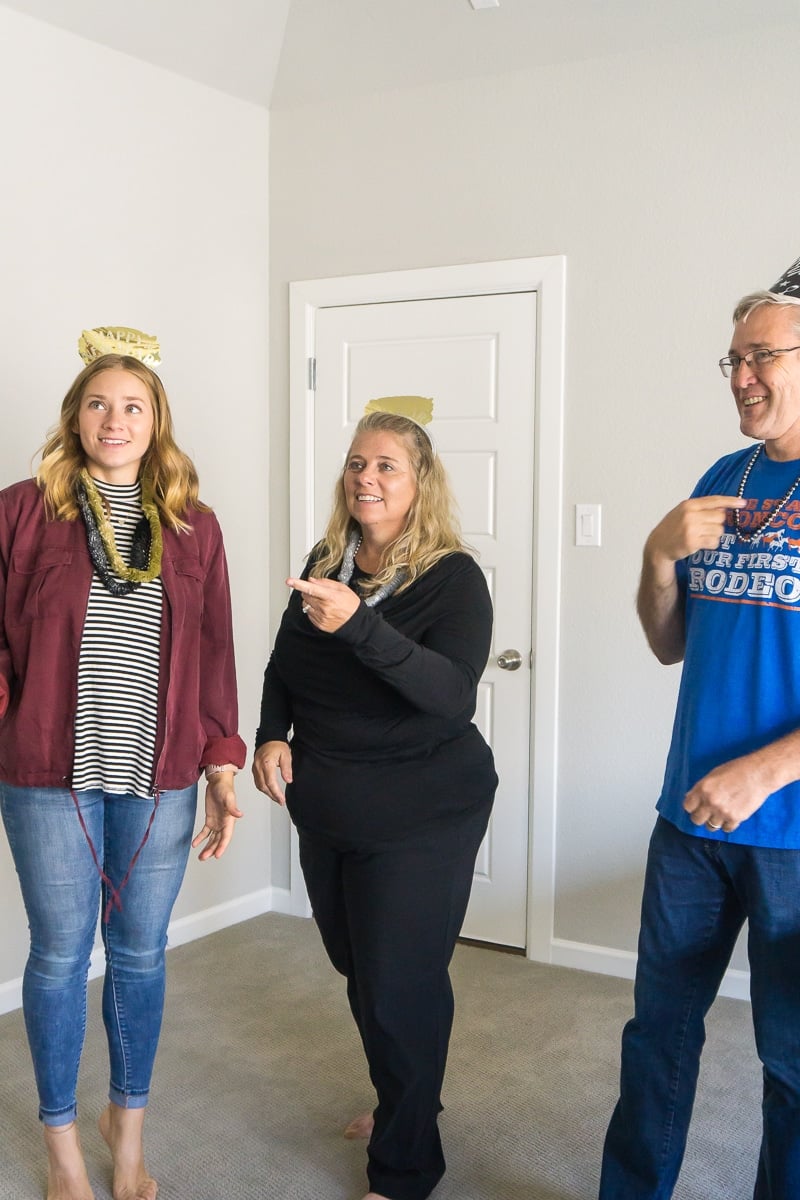 Acting out celebrities in a New Years Eve charades game