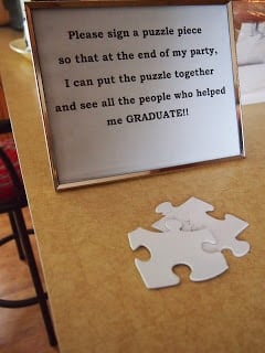 Puzzle pieces with a graduation sign