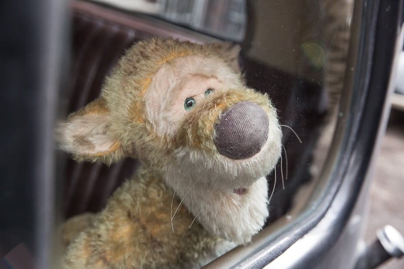 Tigger sitting in a car in Disney's Christopher Robin movie