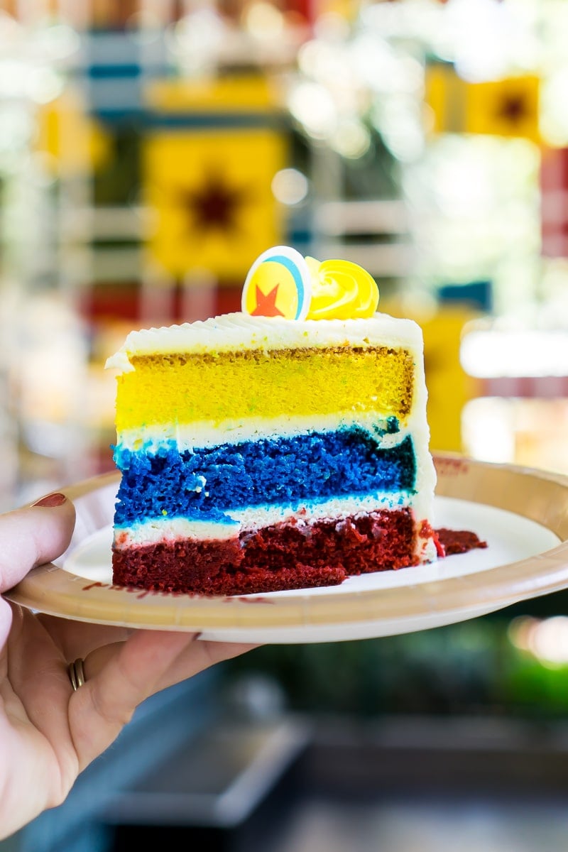 The Pixar layered cake is one of the best Pixar Fest food menu items