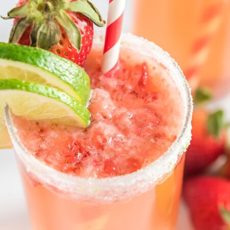 Strawberry mocktail garnished with strawberry citrus fruits