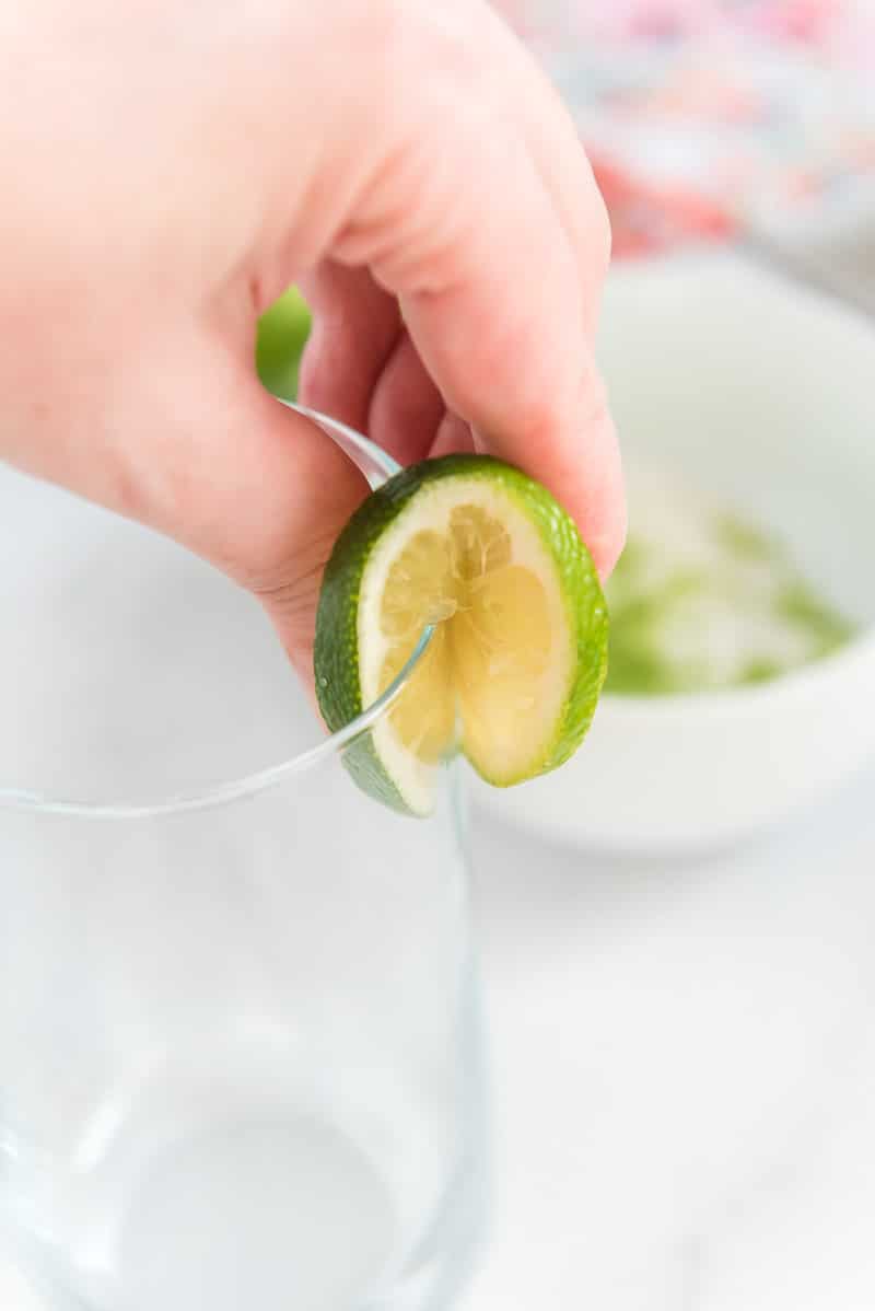 Garnish being added to a strawberry mocktail