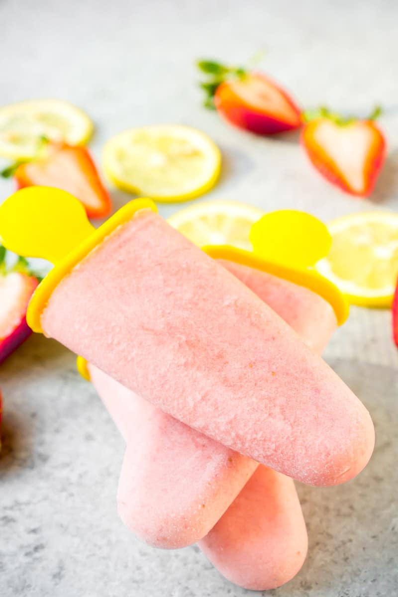 Healthy fruit popsicles stacked on top of each other