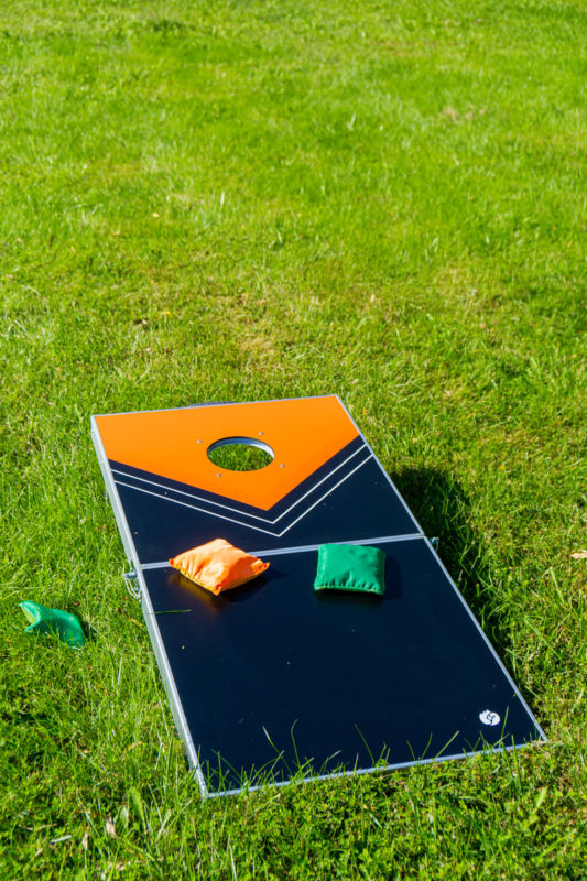 Corn hole board and other outdoor games