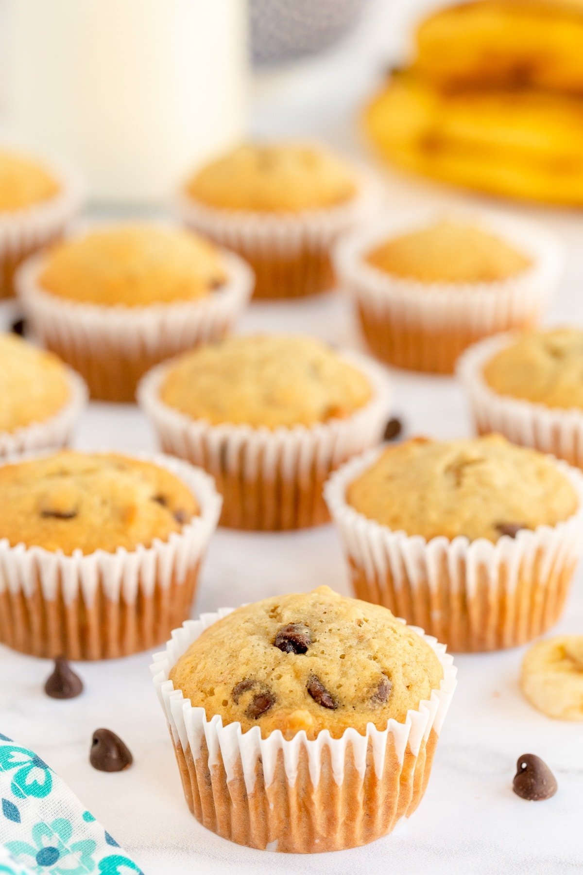 banana chocolate chip muffins in white cupcake wrappers