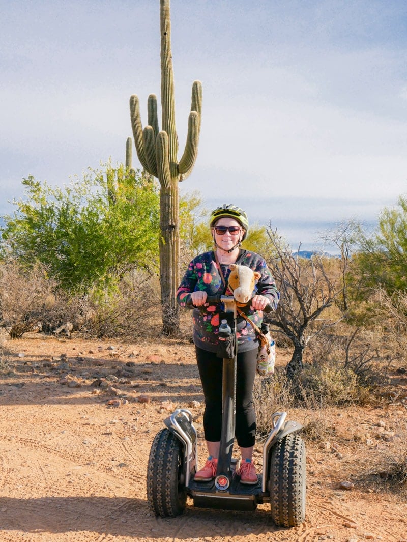 A girl riding a segway in the desert as part of the Fort McDowell Adventures tour