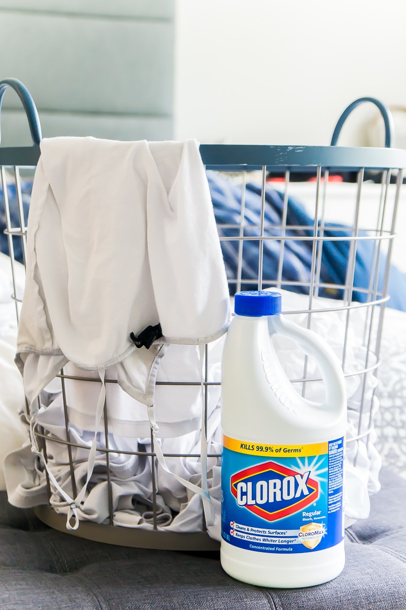 A basket of white clothes and a tutorial on how to bleach a shirt