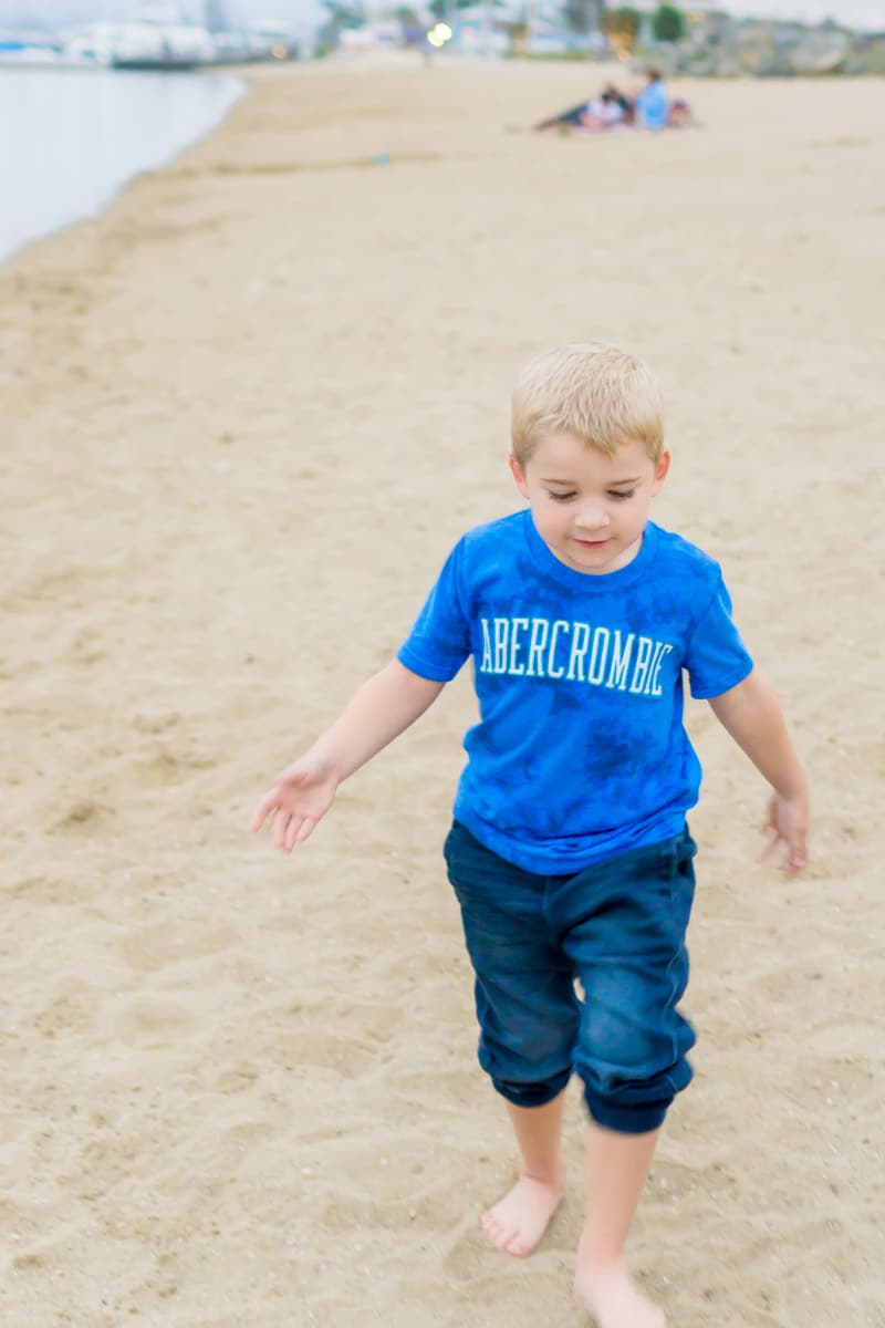 Kid playing in the sand while getting ready for kindergarten