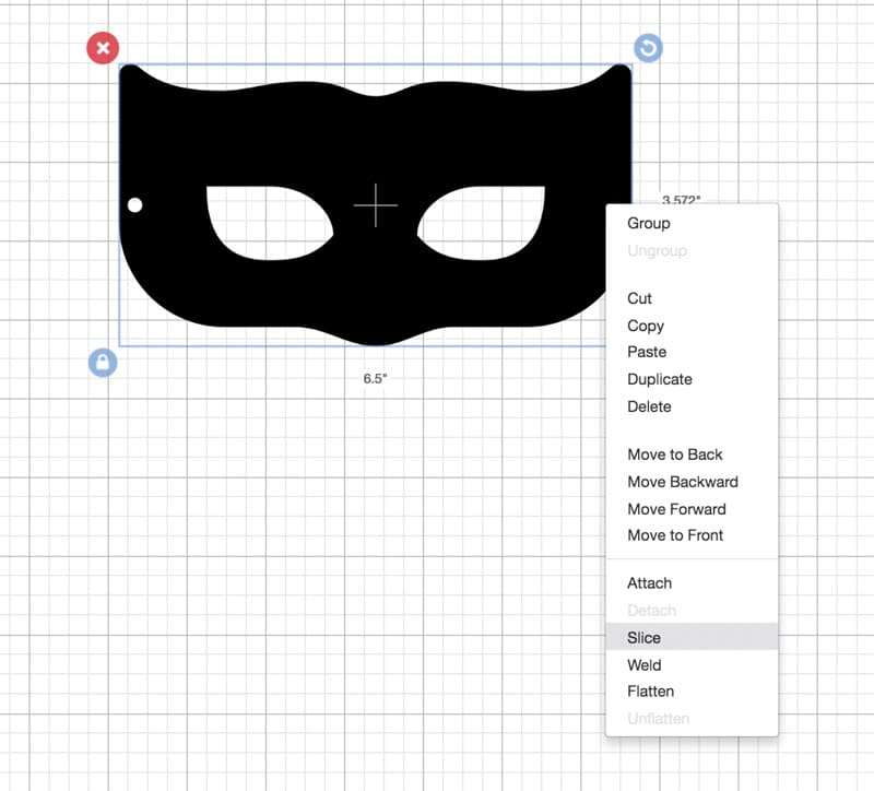 Showing how to slice objects on Cricut for a DIY superhero mask