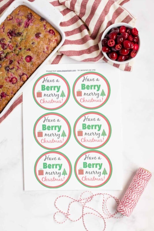 Berry holiday gift tags with cranberry orange bread in the background