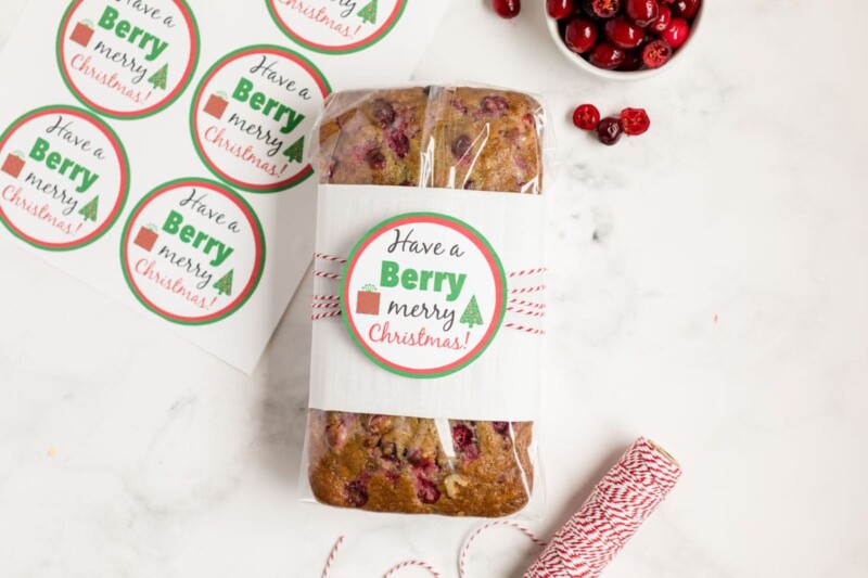 Cranberry orange bread wrapped up in a berry holiday gift tag