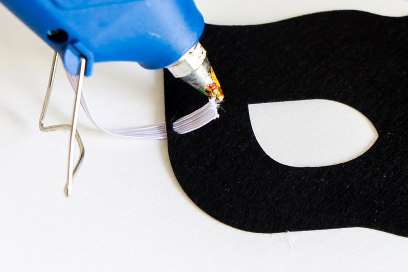Gluing elastic onto a DIY superhero mask