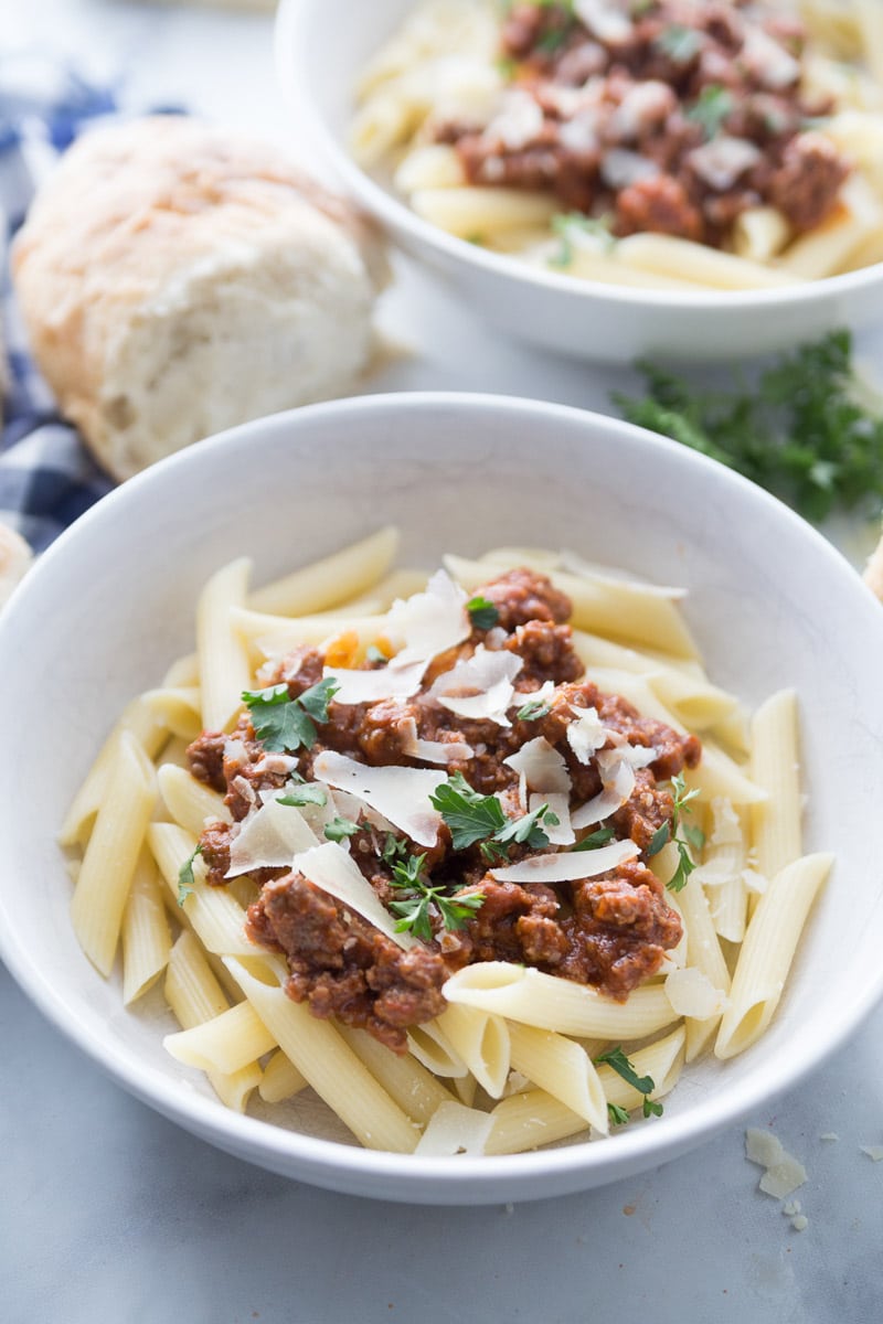 A dinner bowl full of pasta with the best spaghetti sauce on top