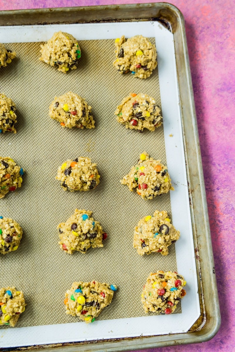 Monster cookie dough on a cookie sheet