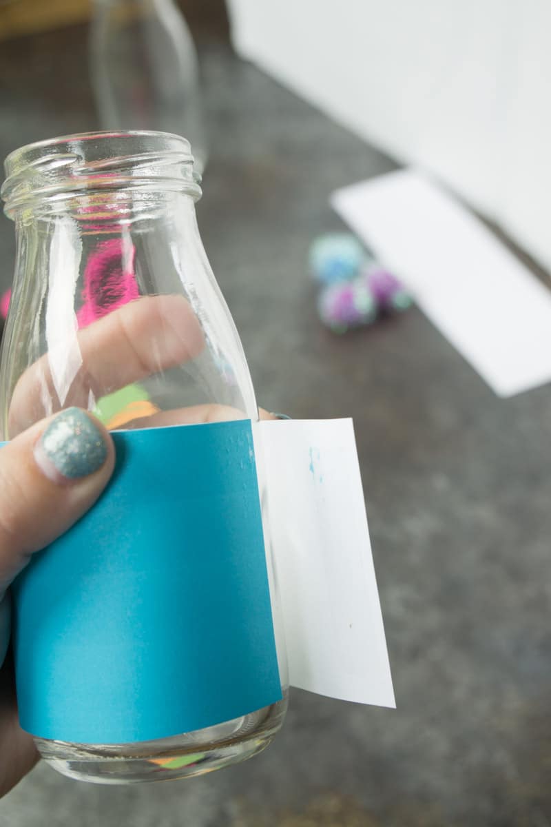 Taping on free printable Halloween bottle labels
