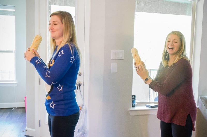 Women playing Christmas party games like three French hens