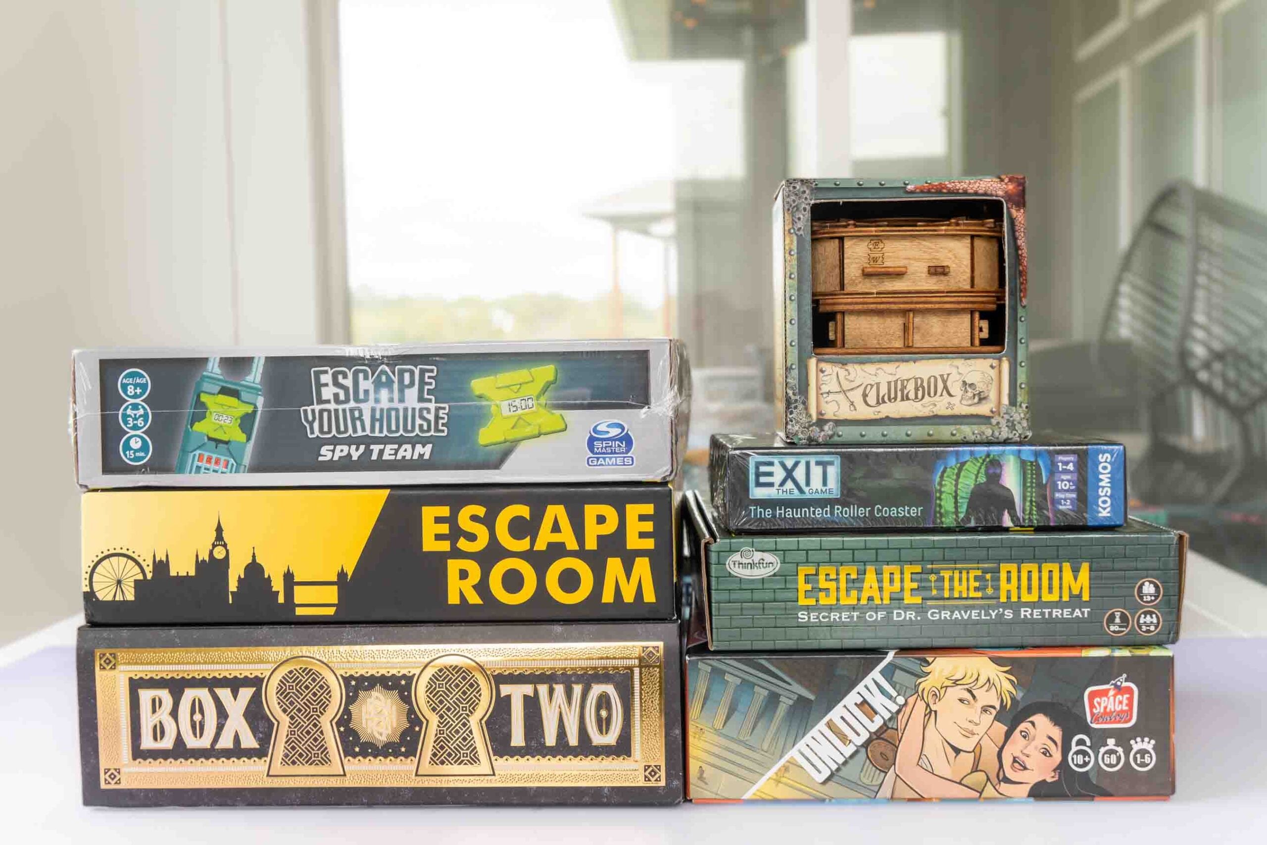 stack of escape room board games