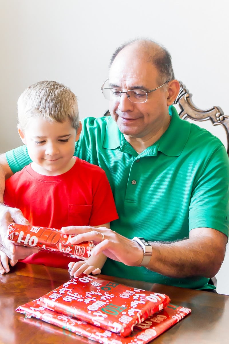 Grandpa and grandson opening what will be the best gifts for grandparents