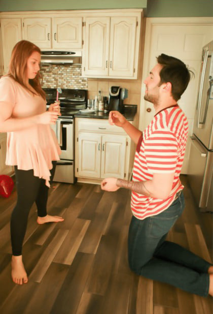 woman and man holding a chopstick and gummy ring