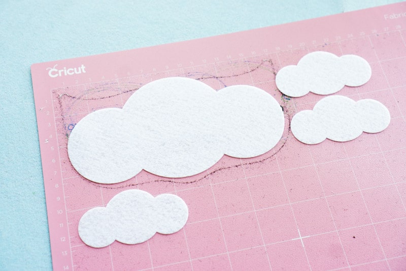 White felt clouds cut out for a DIY St Patrick's Day project