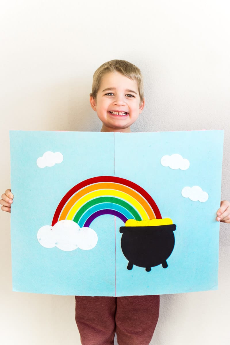 Kid holding a DIY St Patrick's Day pot of gold game