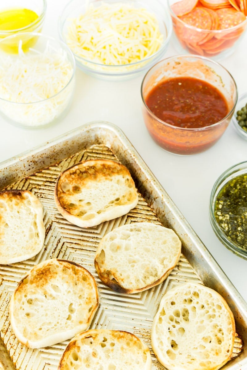 A topping bar to make simple English muffin pizzas