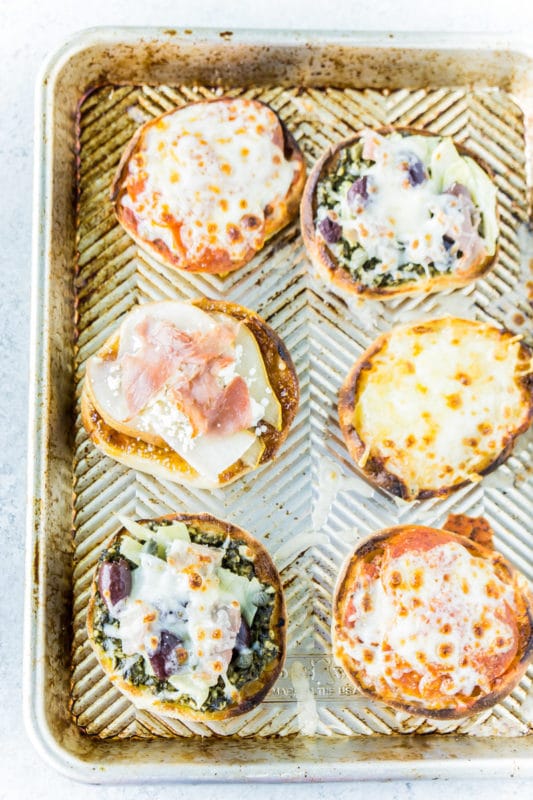 Cooked English muffin pizza on a pan