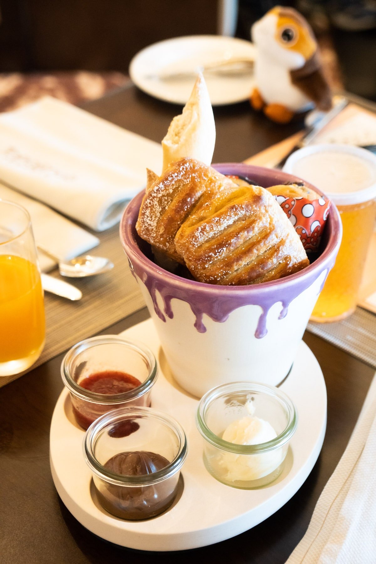 Basket of pastries with three dipping sauces