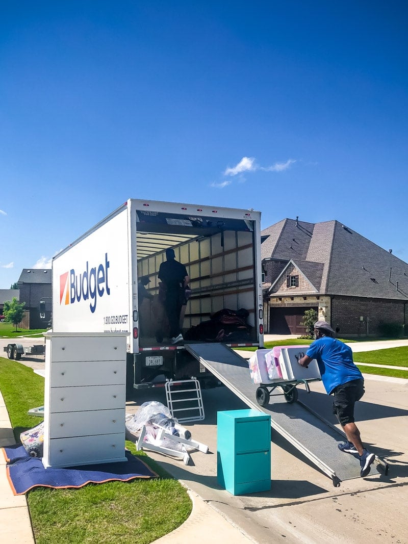 Hire a Helper moving things into a truck