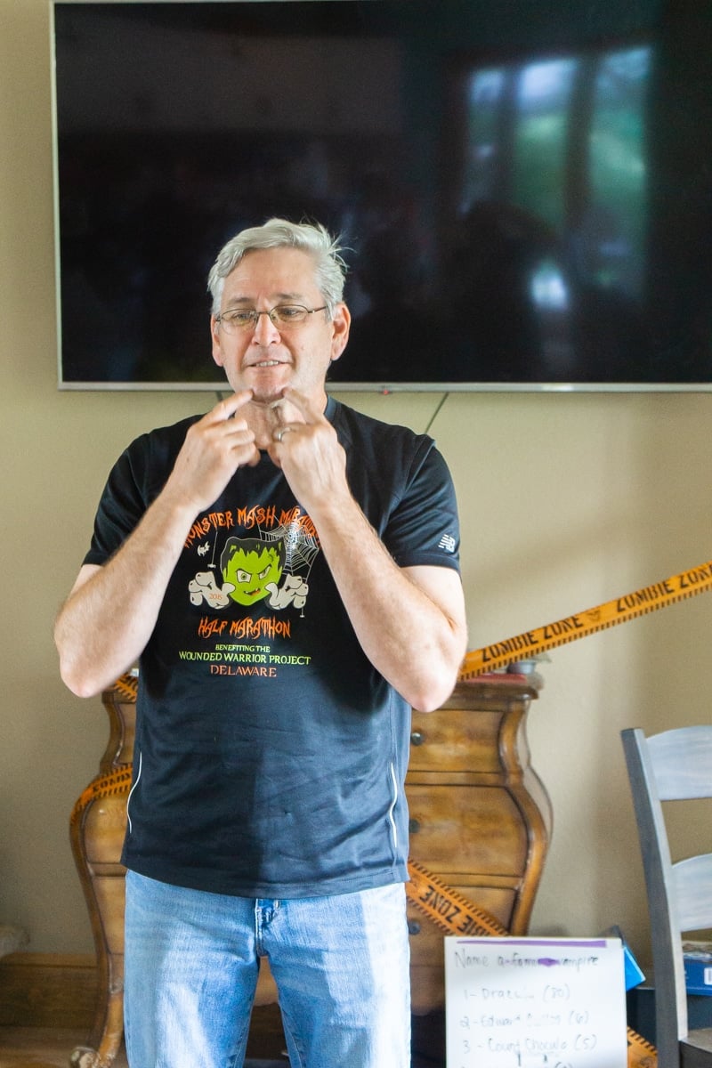 Man playing adult Halloween games