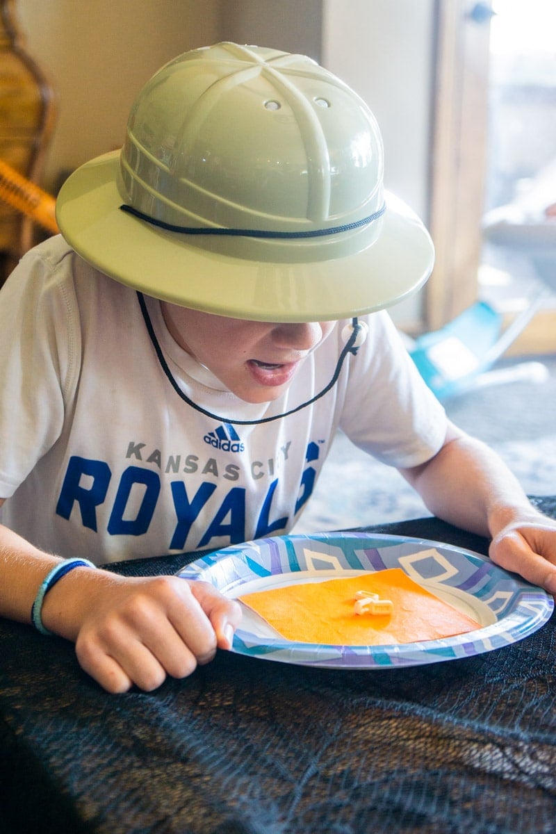 Kid in costume playing gross Halloween food game