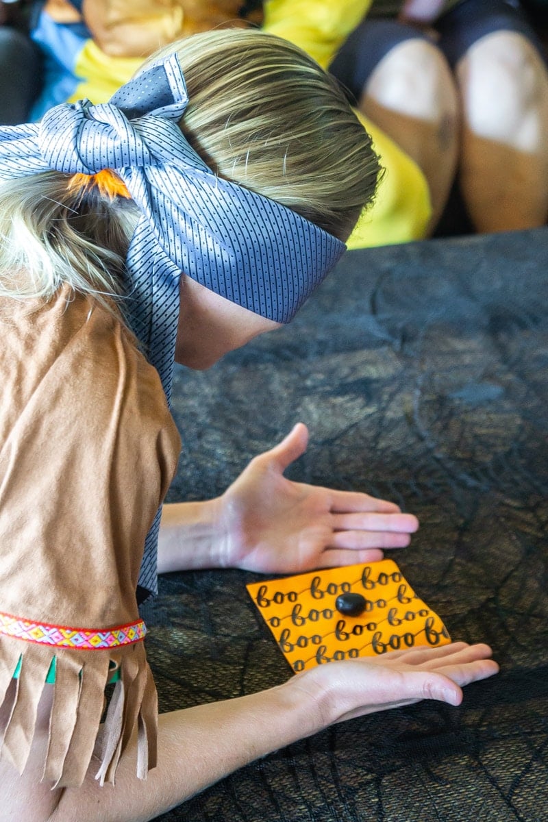 Holding napkin during guess the food game