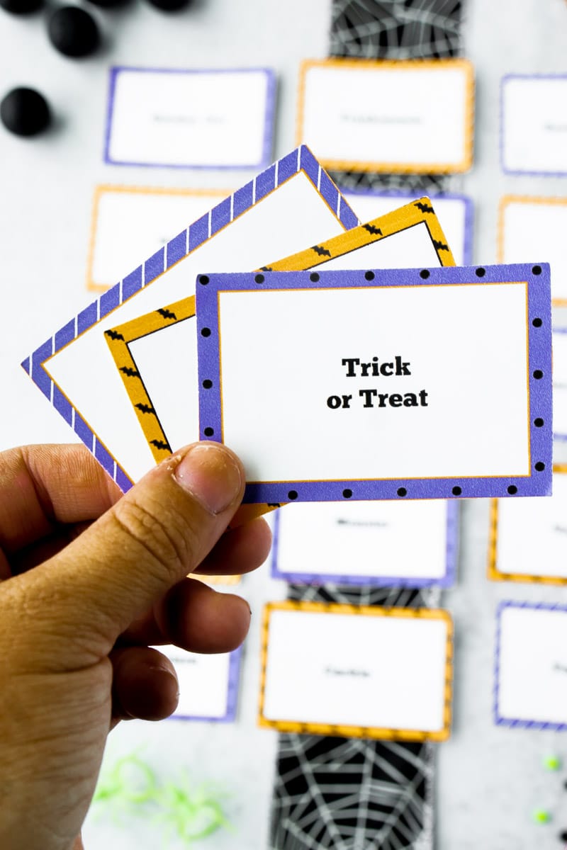 Halloween charades words in a hand