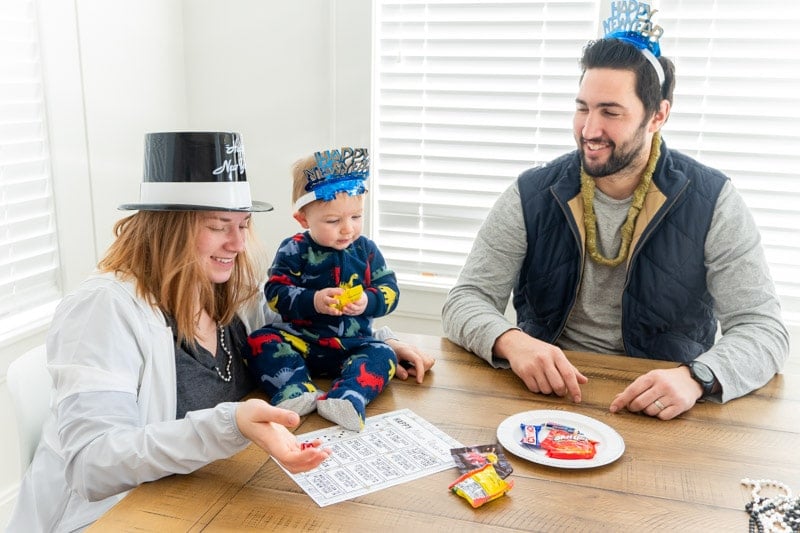 Family playing a New Year's Eve dice game