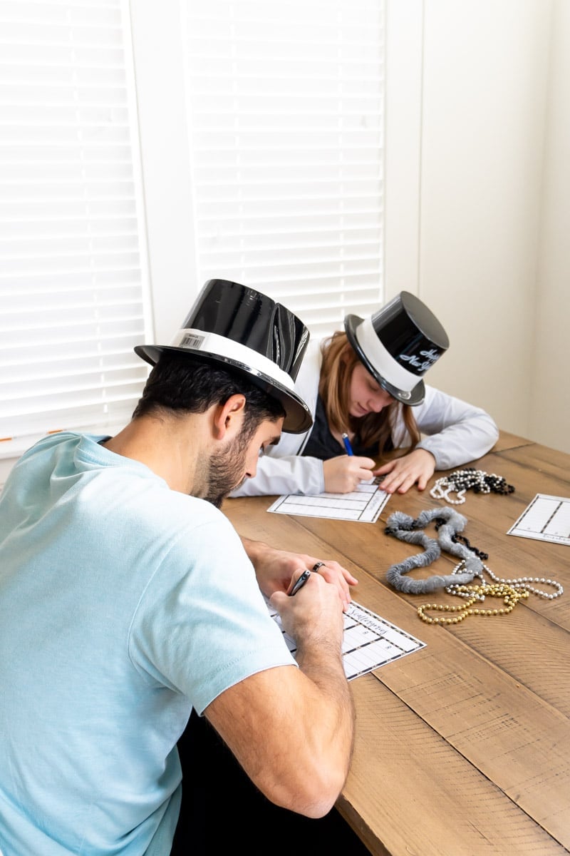 People playing a New Year's Eve scattergories game