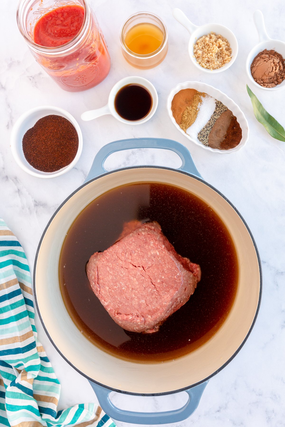 beef in a pot with beef broth