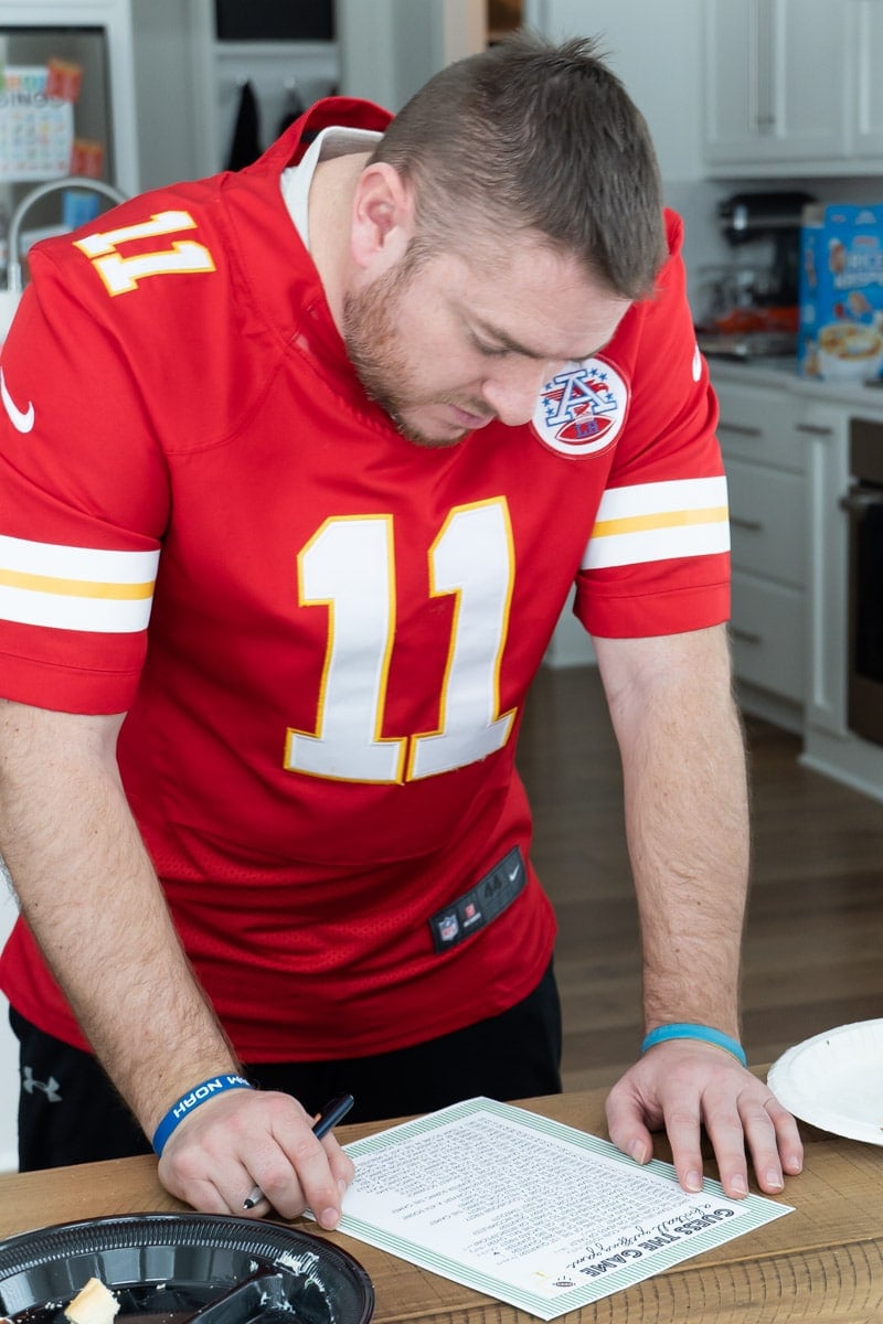 Man reading a Super Bowl printable game