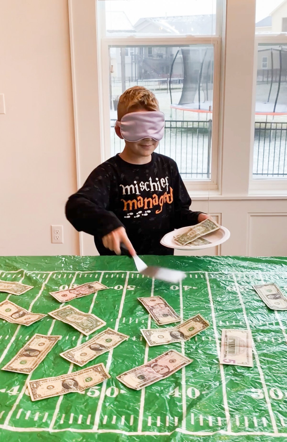Kid playing a super bowl party game